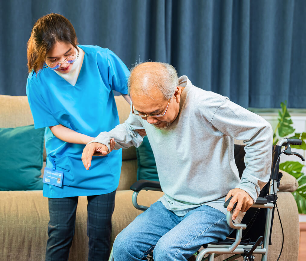 Caregiver talking with an elderly client